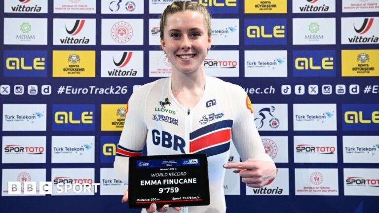 Emma Finucane: Welsh track cyclist sets new world sprint record Emma Finucane with sign showing her world record