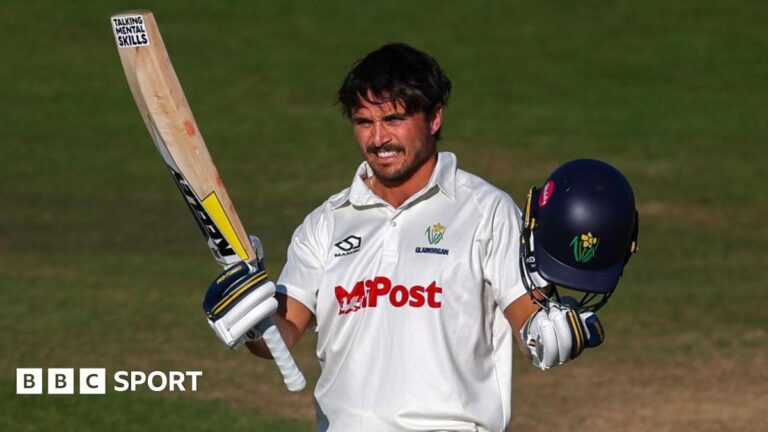 Kiran Carlson: Can Glamorgan club captain ‘prove doubters wrong’ in Division One? A smiling Kiran Carlson acknowledges the crowd with bat in one hand and helmet in the other