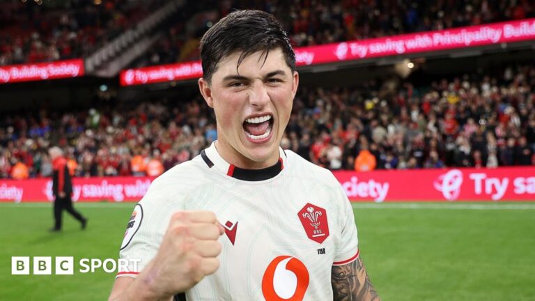 Louis Rees-Zammit: ‘No bigger game’ than Wales v England, says full-back Louis Rees-Zammit pumps his fist in celebration for Wales while standing on the pitch