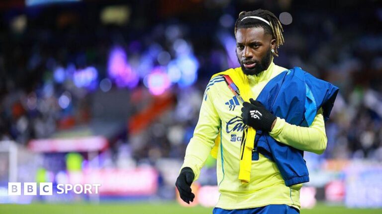 Saint-Maximin parts with club ‘after children racially abused’ Allan Saint-Maximin walking alongside the pitch. He has black hair, tied back, with blonde tips.