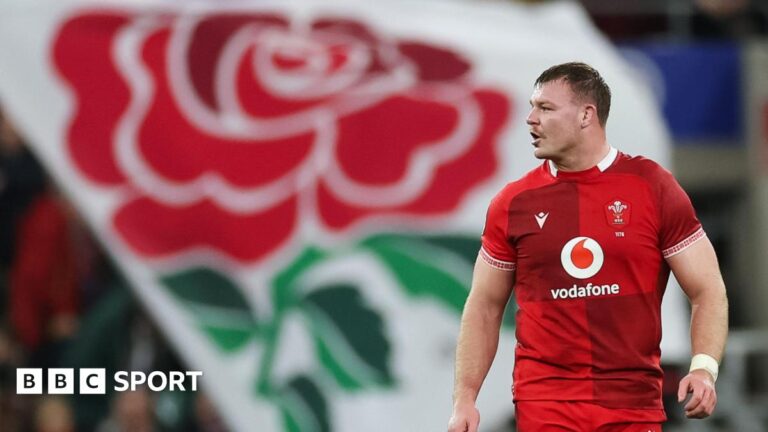 Six Nations 2026: England 48-7 Wales – Dewi Lake says players let nation down Dewi Lake with the English red rose flag behind him