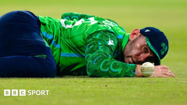 T20 World Cup: Ireland let Sri Lanka off the hook as co-hosts ease to opening win Ireland's Ross Adair lies on the ground after missing a catch