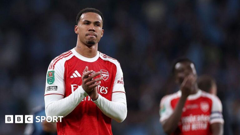 Arsenal: Six players forced out of internationals as injuries bite for Premier League title hopefuls Gabriel Magalhaes, in Arsenal's red and white shirt, claps fans after playing in the Carabao Cup final