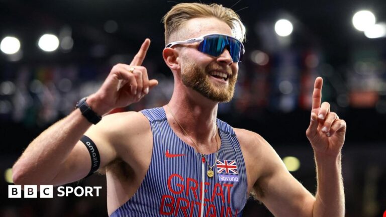 Josh Kerr celebrates winning world indoor 3,000m gold
