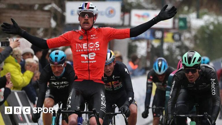 Paris-Nice: France’s Dorian Godon wins shortened Paris-Nice stage seven Dorian Godon holds out his arms as he rides his bicycle next to several other competitors