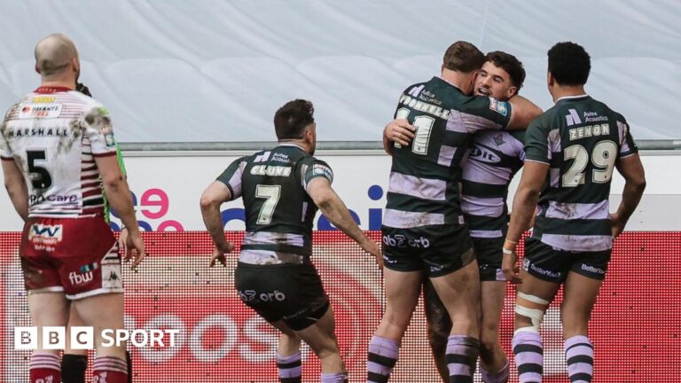 Super League: Wigan 16-34 Huddersfield – shock win for Giants Connor Wrench (right) is mobbed by three team-mates after scoring a try as Liam Marshall (MARSHALL- 5) looks on