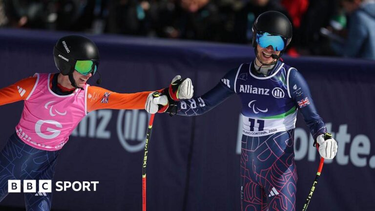 Winter Paralympics 2026: Fred Warburton competes just a year after first race James Hannan and Fred Warburton bump fists after crossing the finish line of the downhill at the Winter Paralympics