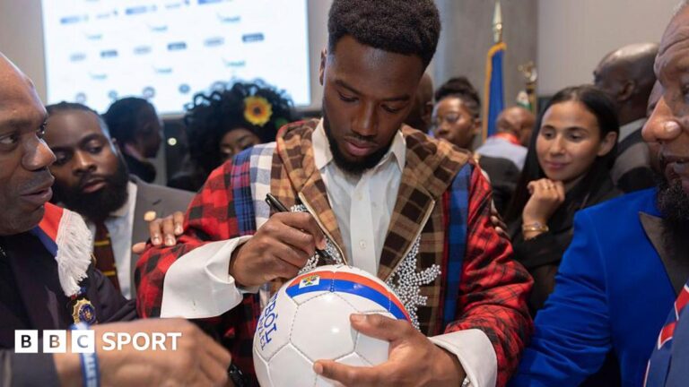 Duckens Nazon: Haiti’s record scorer on facing Scotland at World Cup and escaping Iran Duckens Nazon signs a football