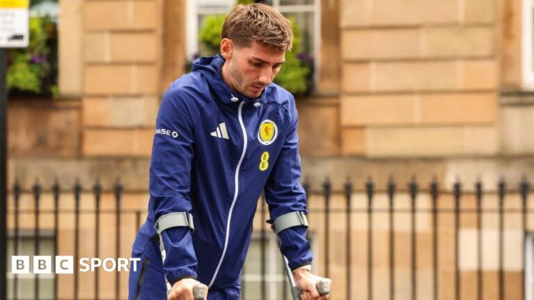 Scotland: Billy Gilmour admits mental struggle as he misses World Cup Scotland's Billy Gilmour leaves the team hotel on crutches
