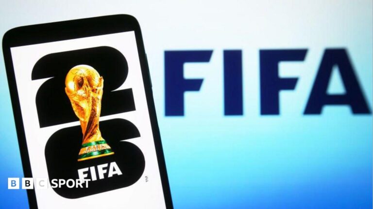 World Cup 2026: 14 times more harmful social media posts than in 2022 In this illustration, a World Cup 2026 logo is shown on a smartphone screen in front of a Fifa logo