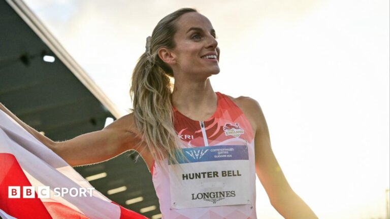 Commonwealth Games 2026: Georgia Hunter Bell eyes golden sweep after Glasgow win Georgia Hunter Bell smiles while unfurling an England flag