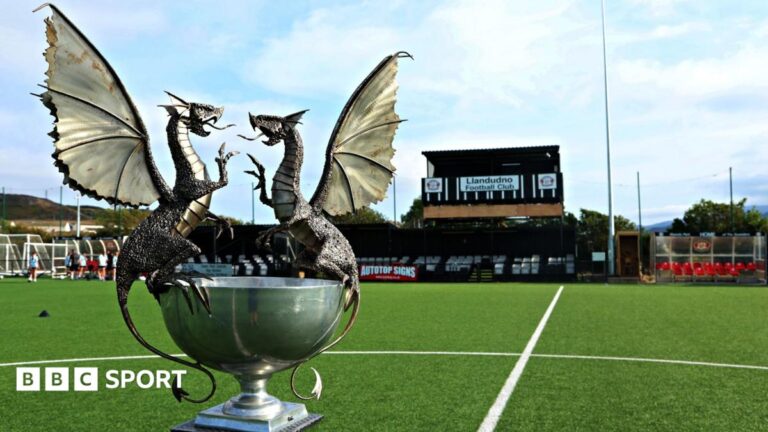 Cymru Premier: BBC agrees three-year deal to broadcast at least 20 live games each season Cymru Premier trophy on the pitch at Llandudno FC