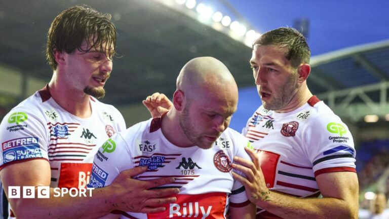 Super League: Wigan Warriors 46-0 Hull KR – Hosts go top on night of tributes for Sir Billy Boston Liam Marshall (centre) celebrates scoring one of his tries for Wigan Warriors