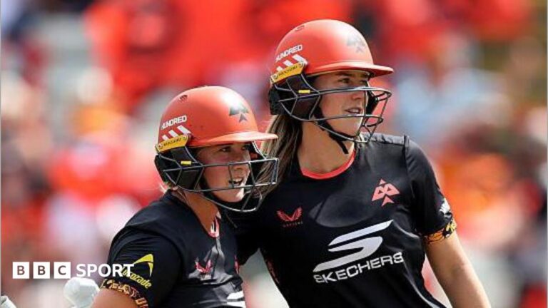 The Hundred 2025: Birmingham Phoenix end winless run with victory over Welsh Fire Alice Capsey (left) and Ellyse Perry, both wearing black tops and orange helmets