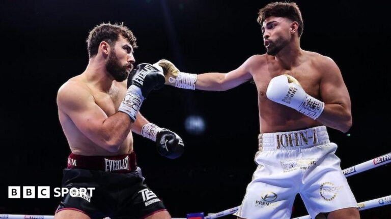 John Hedges vs Pat Brown: Manchester-born Brown wins British and Commonwealth titles Pat Brown and John Hedges have their hands up as they fight