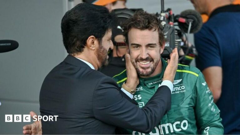 FIA president Mohammed Ben Sulayem embraces Fernando Alonso in parc feme during the 2024 Azerbaijan Grand Prix in Baku