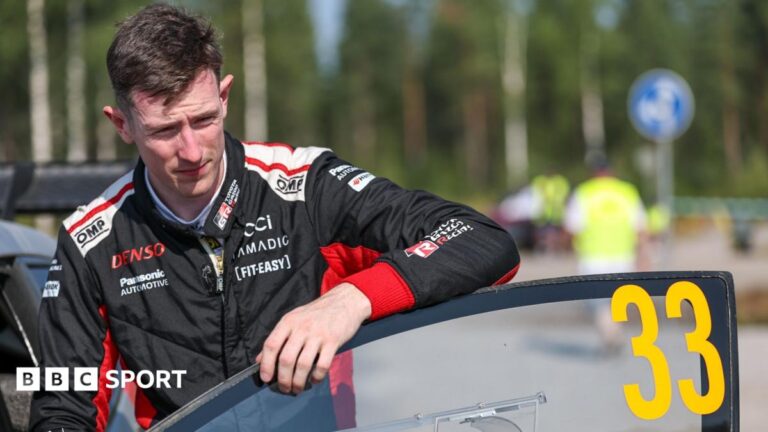 World Rally Championship: The five titles that got away as Elfyn Evans closes in on elusive crown Elfyn Evans in black and red overalls leans on the open door of his number 33 rally car